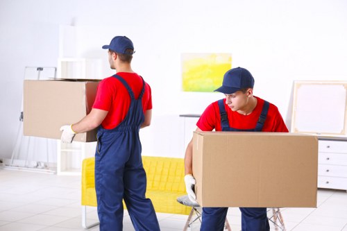 Removal team planning a flat move in West Kensington near period apartment buildings
