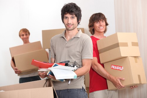 Moving van and boxed household items during a West Kensington relocation