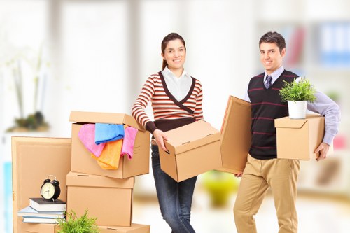 Local moving team handling boxes and furniture in West Kensington