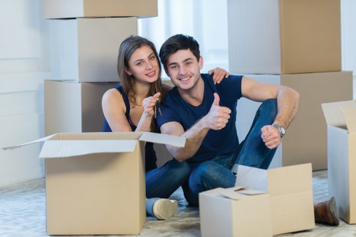 Furniture removals team planning a move in a West Kensington street