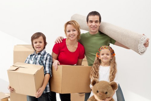 Local movers transporting household items for a West Kensington flat move