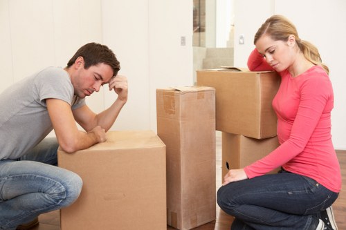 Removalists loading household items into a van in West Kensington
