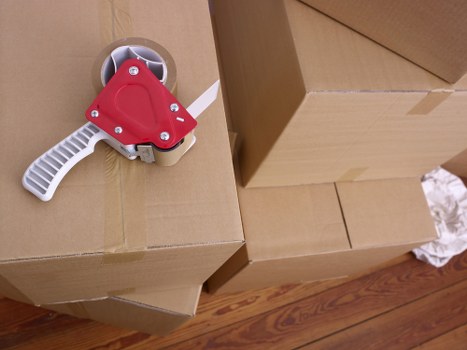 Packed cartons ready for a flat or office move in West Kensington